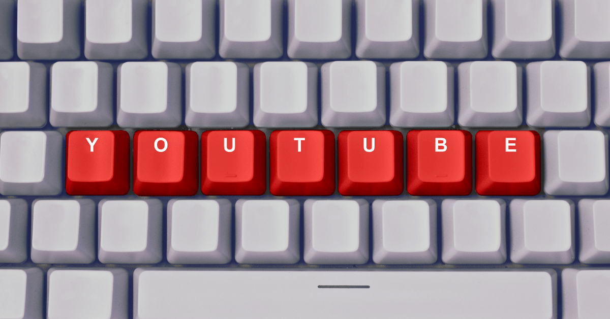 A White keyboard. In the keyboard button is written with the word youtube in red color. Each letter in each button.